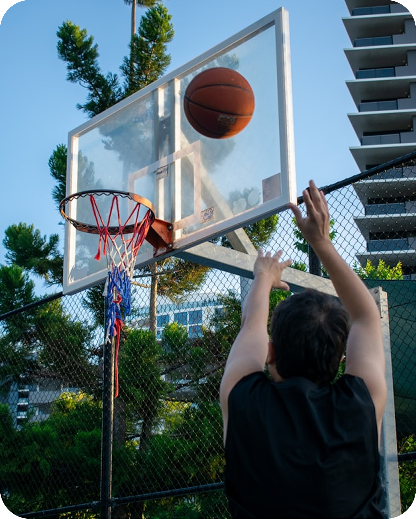 Basketball hoop with hands reaching